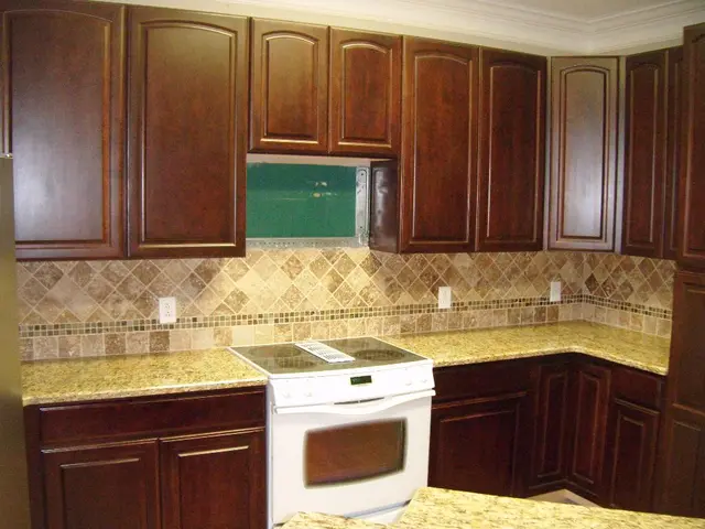 Experts weigh in on the importance of installing flooring beneath kitchen cabinets