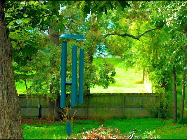 In this edited image, we can see some trees. There is a decor in the middle of the image. There is...