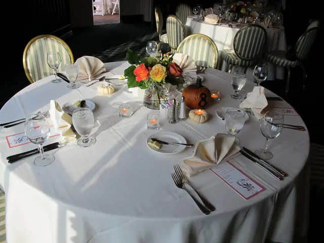 This is the picture of a dining tables which has chairs around them and on the table we can see a...